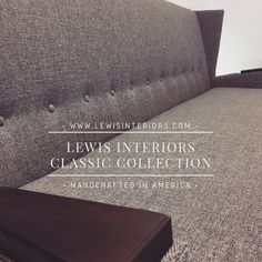 a gray couch with the words lewis interiors classic collection on it's back side