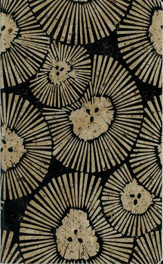 a black and white pattern with gold flowers on it's side, in the middle of