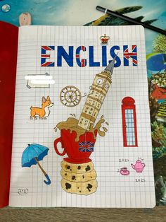 a notebook with an image of a tower and the words english written in blue on it