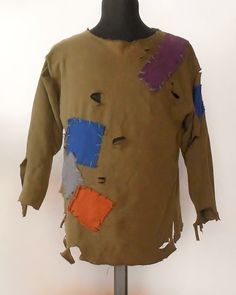 a mannequin's shirt with multiple colored patches on it