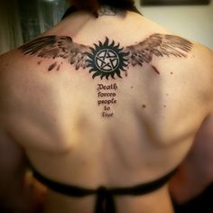 the back of a woman's tattoo with an angel and pentagramil on it