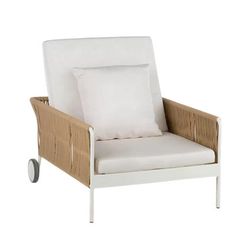 a white chair with two pillows on it and a pillow in the middle of the seat