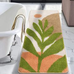 a bathroom rug with a plant design on it