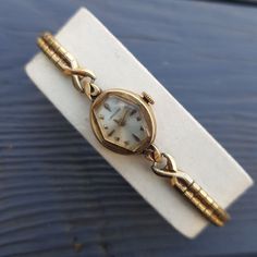 "Antique absolutely gorgeous ladies wrist watch by Longines. It features the original mechanical movement and dates back to the 1963. Watch features a Speidel stretchable band that forms to your wrist at almost any wrist size. The watch is marked on the back \"10K Gold Filled\". Movement: Longines Watch Co. Swiss Movement Serial Number:12476498. Jewels: 17j. Case: Longines - Wittnauer Watch Co. Inc. - New York - Geneva - Montreal - S&W.  Case Grade: 10K Gold Filled. Serial Number: 413349. Measures: 16 mm with crown. Weight: 0.4 oz. (12 grams). Vintage Longines watch is in good pre-owned condition. Not running. Very rare and collectible model. A perfect gift for women and a nice addition to any watch collection. A very scarce and beautiful time piece, your investment in this watch will neve Longines Watch Ladies, Dior Watch, Ladies Wrist Watch, Art Deco Watch, Antique Costume Jewelry, Longines Watch, Vintage Watches Women, Womens Watches Luxury, Antique Watches