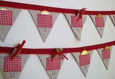 a red and white checkered bunting banner hanging from the side of a wall