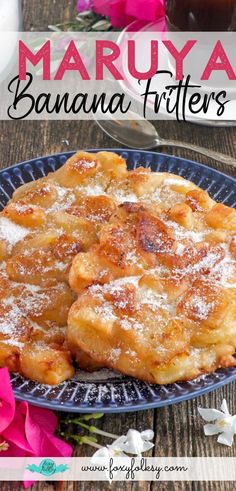 this is an image of a banana fritters on a blue plate with pink flowers