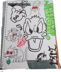 an open notebook with cartoon drawings on it