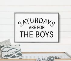 a sign that says saturday's are for the boys in black on a white wall