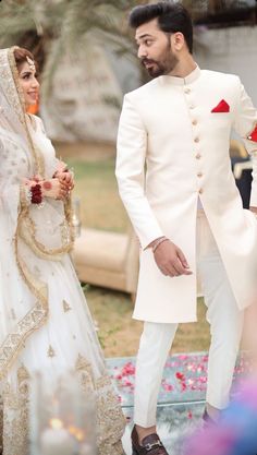 a bride and groom standing next to each other