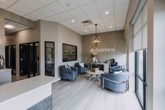 the lobby is clean and ready for customers to come home in this modern office building