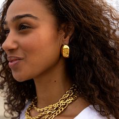 The bold design is sure to turn heads and elevate any outfit. Their versatility allows for endless options to express your personal style. Add a bold, daring touch to your every day look. Bold Statement Earrings Length: 1.5" x 2" Material: Stainless Steel Plating: 18k Real Gold Earrings are 100% nickel-free and cadmium-free Necklace are hypoallergenic and tarnish resistant Bold Metal Jewelry For Everyday, Bold Everyday Earrings, Everyday Metal Plug Earrings, Bold Gold Everyday Jewelry, Bold Gold Drop Earrings, Bold Metal Drop Earrings, Trendy Bold Design Earrings, Real Gold Earrings, Jewel Necklace