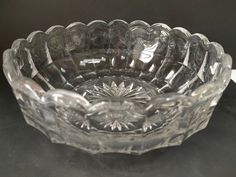 a clear glass bowl sitting on top of a table