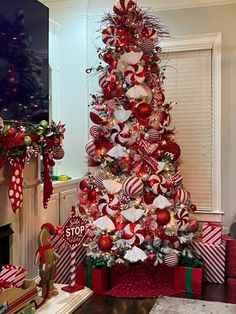 a christmas tree decorated with red and white ornaments