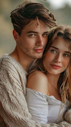 a young man and woman are posing for a photo in front of the camera with their arms around each other