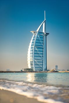 a very tall building sitting in the middle of the ocean