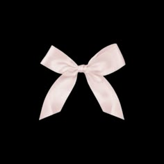 a pink bow on a black background