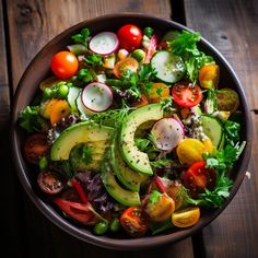 a salad with tomatoes, cucumbers, radishes and avocado