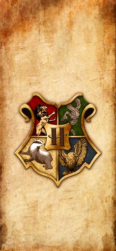 the hogwarts crest on an old parchment paper with grungy edges photo