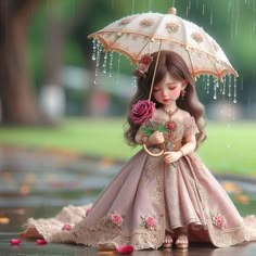 a doll is holding an umbrella and standing in the rain with flowers on it's head