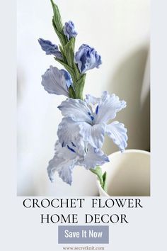 a blue and white flower in a vase with the words crochet flower home decor save it now