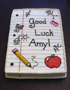 a sheet cake with writing on it that says good luck and an apple next to a pencil