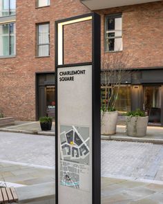 a sign in front of a building that says charlemont square on it's side