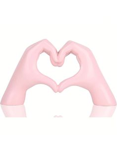 two hands making a heart shape with their fingers in the air, against a white background