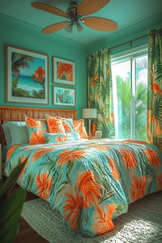 a tropical bedroom with blue walls and orange bedding, palm leaves on the comforter