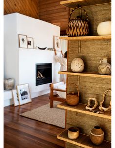 a living room filled with furniture and a fire place