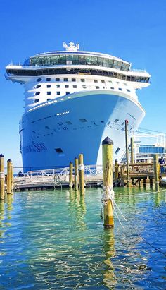 a large cruise ship docked at a pier