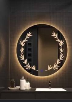 a bathroom with a round mirror above the sink and lights on the wall behind it