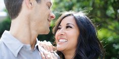 a man and woman smiling at each other