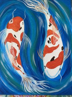 two orange and white koi fish swimming in blue water