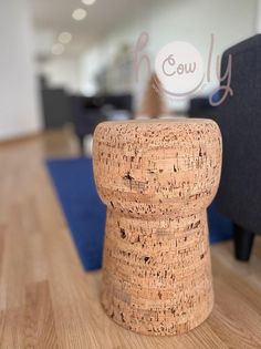 a close up of a cork stool on a wooden floor