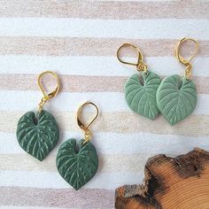 Adorn your ears with the lush beauty of Philodendron Dangle Earrings, perfect for those who cherish botanical-inspired accessories. These customizable Leaf Plant Earrings make an exquisite gift idea, adding a touch of greenery to any plant lover's decor and wardrobe. ● Can be customized to suite your style.  ● Polymer clay = lightweight for all-day comfort.  ● Stainless steel hardware. ● Slight variations may occur as they are handmade. For sneak peaks of new designs or for when we are having a Green Botanical Drop Earrings Jewelry, Green Leaf-shaped Earrings As A Gift, Green Leaf-shaped Earrings For Gift, Green Nature-inspired Everyday Earrings, Everyday Green Nature-inspired Earrings, The Roommate, Leaf Jewellery, Green Earring, Plant Earrings