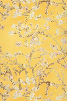 a yellow wallpaper with white flowers on it