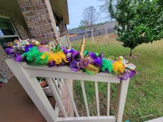 the front porch is decorated for mardi gras