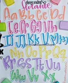 the letters and numbers are drawn with colored crayons on white paper, which is covered in marker markers