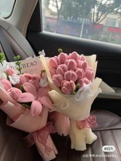 a bouquet of flowers sitting in the back seat of a car