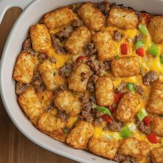 a casserole dish with tater tots and cheese