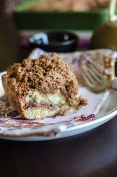 a piece of cake sitting on top of a plate next to a fork and knife