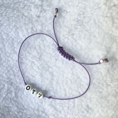 BTS OT7 bracelet, simple, waterproof and adjustable bracelet in purple.  I created this as a reminder of BTS to be worn during enlistment until all 7 members to return safely in 2025.   -Made of Korean waxed thread, with a beautiful soft sheen and delicate style.   OT7 beads are made of porcelain ceramic/high fired clay, not plastic.  They are very sturdy and pretty much unbreakable.   -All of my bracelets stay clean and hygienic, you can wash them in the shower without affecting the color or qu Casual Purple Friendship Bracelets With Letter Beads, Casual Purple Friendship Bracelet With Letter Beads, Bts Bracelets, Jewelry Kpop, Bts Bracelet, Adjustable Silver Bracelet, Rear View Mirror Accessories, Cat Bead, Bts Ot7