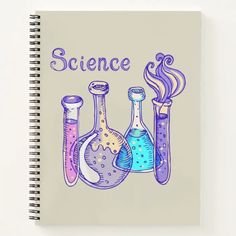 a spiral notebook with three laboratory beaks and the words science on it