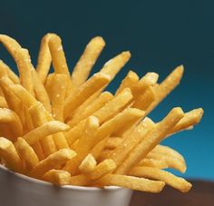 a close up of french fries in a bowl