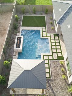 an aerial view of a backyard with a swimming pool