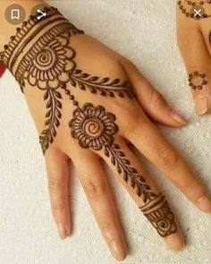 henna tattoo on the palm of someone's hand