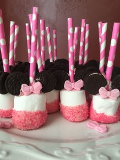 desserts made to look like oreo cookies and marshmallows with pink bows