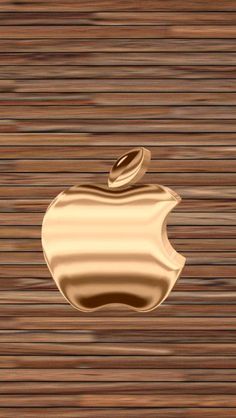 an apple logo is shown on a wooden surface with brown and white stripes in the background