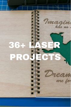 a wooden notebook with the words laser projects written on it and an image of a dinosaur