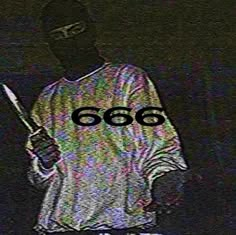 a man with a knife in his hand and the words 666 written on it